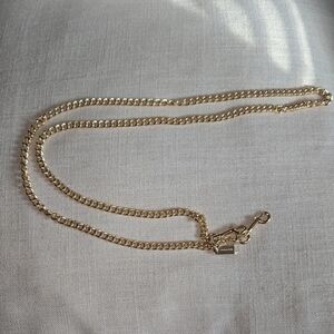 Elegant Gold Coach Purse Strap
